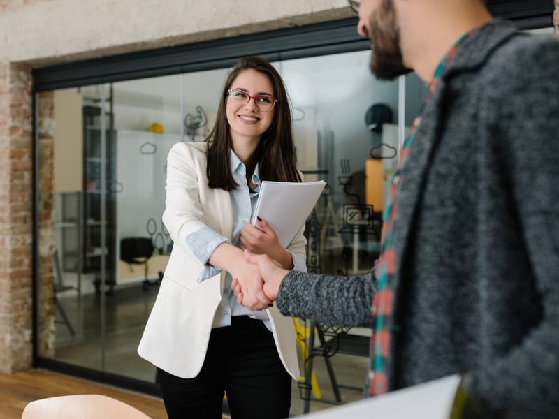 Interview shaking hands with job candidate