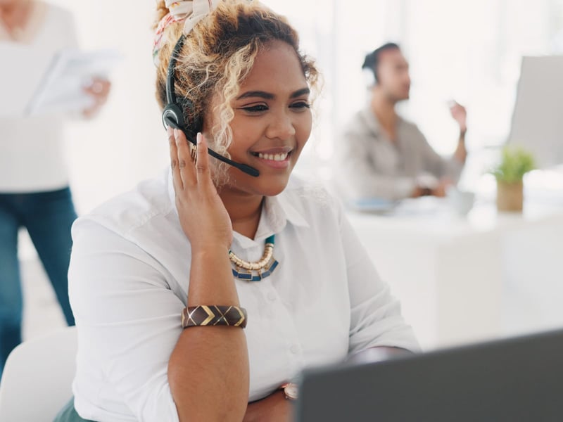 Young woman talking on headset