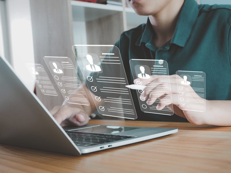 Conceptual image of man browsing applications on laptop